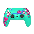 thumb- Turquoise gaming controller with pink floral patterns on a white background