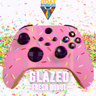 Pink gaming controller with donut design and colorful sprinkles on a white background, featuring 'GOAT Syndicate' logo.
